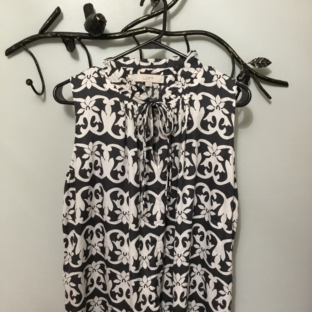 Loft sleeveless blouse with ruffled neckline and tie closures